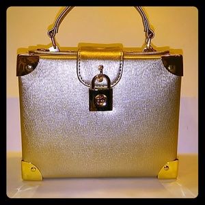 Madison West gold metallic box purse, pre-owned.